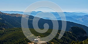 Aerial view from the Ceahlau mountains in Romania in a summer day with blue clear sky