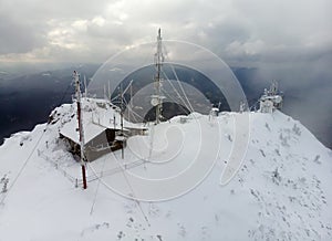 Aerial view of Ceahlau Toaca weather station on top of the mountain