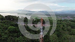 aerial view of cellular antenna, Communication Building Antenna with a backdrop of mountains and sky