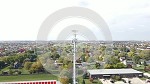 Aerial view of cellular wireless mobile data tower for mobile network. American suburban neighborhood