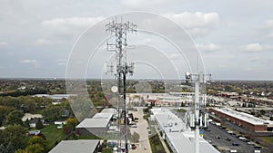 Aerial view of cellular wireless mobile data tower for mobile network. American suburban neighborhood