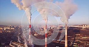 Aerial view of Central Heating and Power Plant chimneys with steam. Sunrise