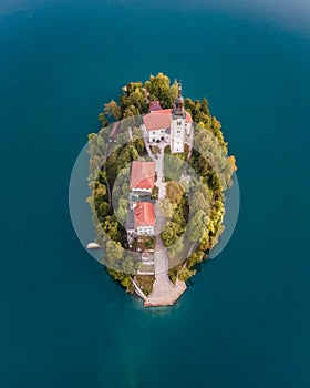 Aerial view of Cerkev Marijinega, a Catholic Church on a small island in the middle of Bled Lake at sunrise, Upper Carniola,