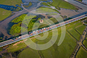 Aerial view of Chalerm Phra Kiat road at daytime in Thale Noi, Phatthalung, Thailand