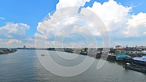 Aerial view of Chao Phraya river which have various transportation boat sail.