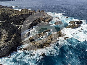 Aerial view on Charco del Viento natural pool in black lava rocks on Tenerife, Canary islands, Spain photo