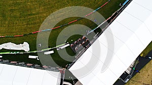 Aerial view of cheerleaders on the side of a stadium during a cricket game