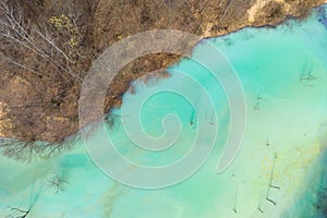 Aerial view of chemical residuals flooding a lake from a copper mine exploitation