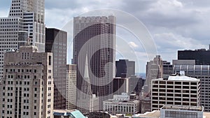 Aerial view of Chicago Loop as military jet soars through clouds