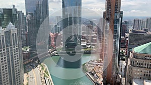 Aerial view of Chicago River and skyscrapers creating shadows on water`s surface