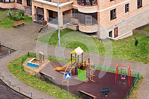 Aerial view children playground and house building exterior mixed-use urban multi-family residential district area