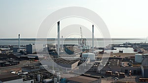 Aerial view of chimneys of petrochemical industries in Esbjerg, Denmark, seaport. The Esbjerg seaport is one of the most