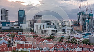 Aerial view of Chinatown with red roofs and Central Business District skyscrapers timelapse, Singapore