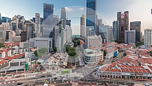 Aerial view of Chinatown with red roofs and Central Business District skyscrapers timelapse, Singapore