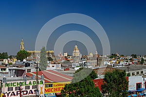 Aerial view of Cholula city with Convent of San Gabriel at background, Mexico.