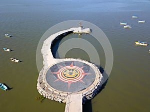 Aerial view of the Christ the Fisher statue seen from the town