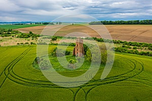 Aerial view about church ruins in the middle of an agricultural field