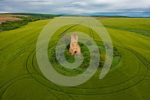 Aerial view about church ruins in the middle of an agricultural field