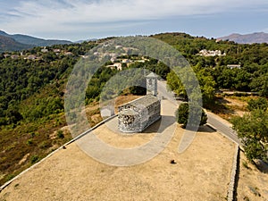 Aerial view of the church of San Michele de Murato, bell tower and apse. Corsica, France