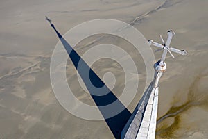 Aerial view church and village flooded by heavy metal residuals from a copper mine. Apocalyptic scene