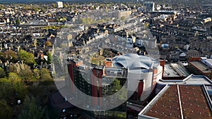 Aerial view circling the Harrogate Convention Centre and town skyline