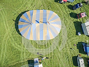 Aerial view of a circus tent and white tigers