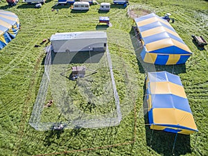 Aerial view of a circus tent and white tigers