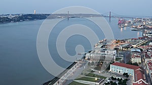 Aerial view on the city, the 25 April Bridge and Tagus River in the evening Lisbon