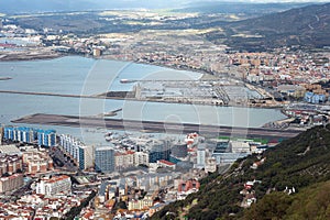 Aerial view on city and airport runway of Gibraltar and Spanish La Linea town on a background