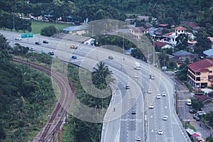 Aerial view of city asphalt road with lot of vehicles or car traffic and buildings, modern urban intersections and