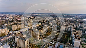 Aerial view of the city buildings in early spring on the sunset.