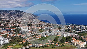 Aerial view of the city of Funchal and Camara de Lobos, tourist and iconic city on the island of Madeira, in Portugal