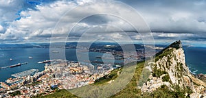 Aerial view on city of Gibraltar from Upper Rock Natural Reserve: on the left Gibraltar town and bay, La Linea town in Spain