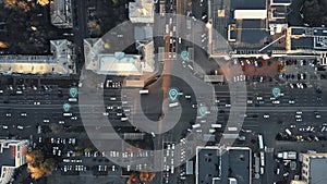 Aerial view of city intersection with many cars and GPS navigation system symbols. Autonomous driverless vehicles in