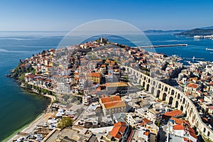 Aerial view the city of Kavala in northern Greek, ancient aqueduct Kamares, homes and medieval city wall photo