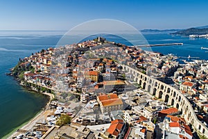 Aerial view the city of Kavala in northern Greek, ancient aqueduct Kamares, homes and medieval city wall