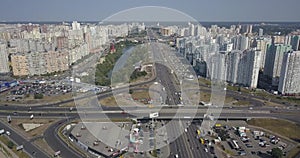 Aerial view of city landscape of Osokorki and Poznyaki district, Kiev Road and modern skyscrapers 4k 4096 x 2160