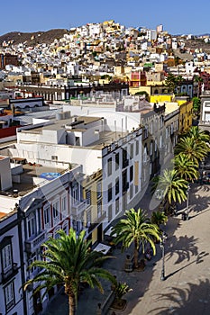 aerial view of the city of Las Palmas with its multi-colored houses on the side of the hills that surround the city. Gran Canaria