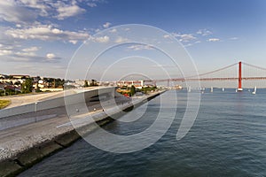 Aerial view of the city of Lisbon with the Tagus River and the 25 of April Bridge on the background;
