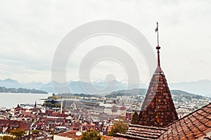 Aerial view of the city of Lucern Switzerland on an overcast day mountains in the background