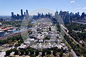 Aerial view of the city of Melbourne in Australia, with trees along the urban street, on a sunny day