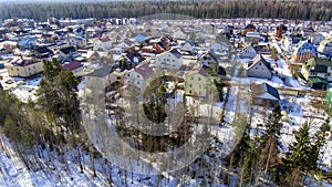 Aerial view of city outskirt with district of low-rise dwellings