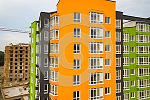 Aerial view of city residential area with high apartment buildings under construction