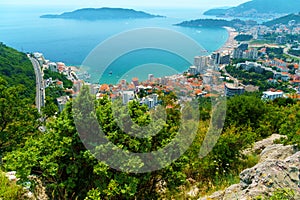 aerial view of the city on the seashore and mountains, panorama of the resorts of Becici and Budva in Montenegro, Adriatic sea,