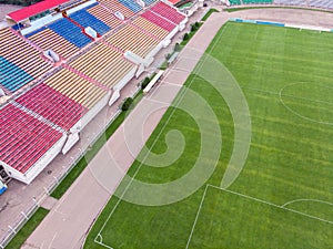 aerial view of city sports stadium with empty seats. soccer field