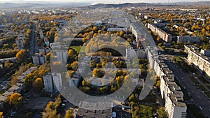 Aerial view of the City, Street, Park, Building, Alley, Trees, Hills in Sunset, Autumn