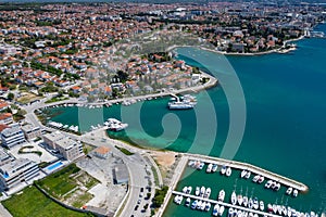 Aerial view of city of Zadar. Summer time in Dalmatia region of Croatia. Coastline and turquoise water and blue sky with clouds.