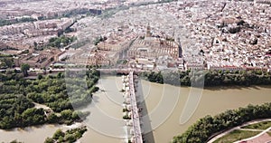 Aerial view of cityscape of Cordoba with Roman Bridge over the Guadalquivir and the Mosque-Cathedral of Cordoba