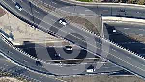 Aerial view of cityscape curve roads with cars