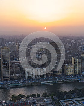 Aerial view of the cityscape in front of the Nile at sunset in Cairo, Egypt